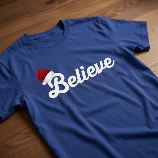 Blue Believe slogan t-shirt with Santa hat on wood, mens fun santa hat christmas text tee