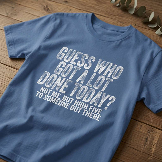 Bright blue Guess Who Got A Lot Done Today t-shirt laid flat on a wooden surface showing the full slogan, funny ladies motivational design full of pure attitude