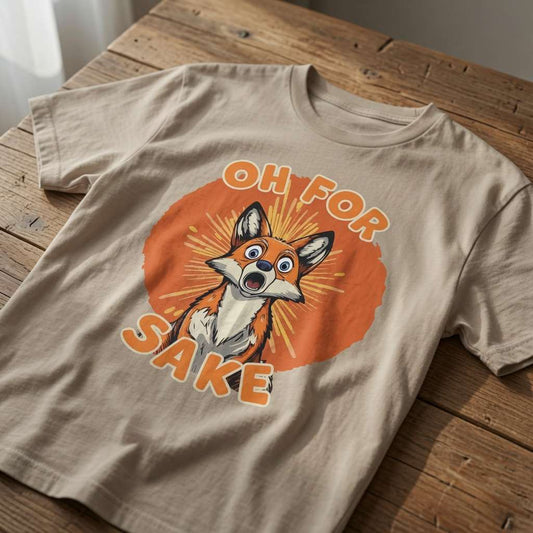 Beige Oh For Fox Sake t-shirt laid flat on a wooden table showing the full shocked fox graphic and bold text, classic fun and slightly crude fox design