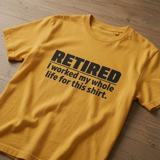 Mustard yellow RETIRED – I worked my whole life for this shirt. t-shirt laid flat on a wooden surface with bold black text, funny mens witty retirement age slogan gift