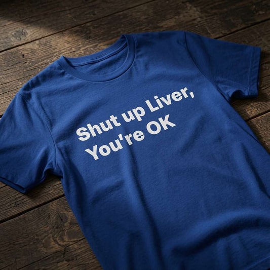 Blue Shut up Liver, You’re OK t-shirt laid flat on a wooden surface with clean white text, witty pub gift design that every drinking lad will claim