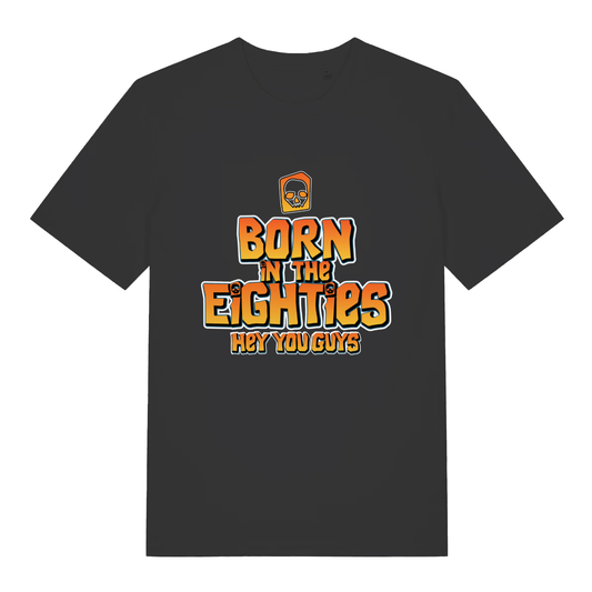 Black Born in the Eighties T-shirt flat lay with Goonies-style "Born in the Eighties Hey You Guys" graphic perfect 80s nostalgia tee