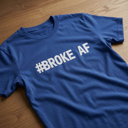Blue #Broke AF slogan t-shirt on wood, humorous skint matching slogan tee