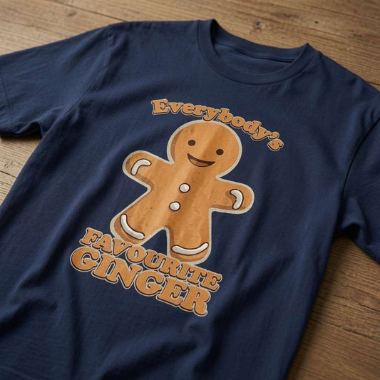 French navy Everybody’s Favourite Ginger t-shirt on wood featuring smiling gingerbread man, witty fun graphic