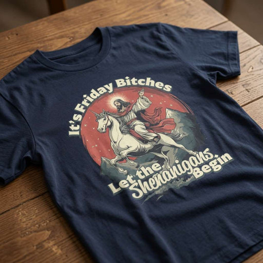 Navy It’s Friday Bitches Let the Shenanigans Begin t-shirt on wood featuring Jesus on unicorn, funny mens witty graphic jesus