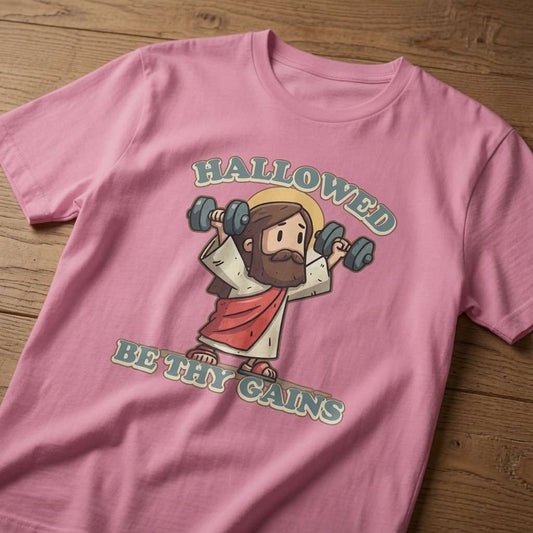 Bubble pink Hallowed Be Thy Gains t-shirt on wood with Jesus gym design, fitness graphic Jesus