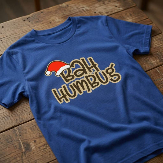 Blue Bah Humbug t-shirt on wood featuring Santa hat text, fun witty mens xmas slogan