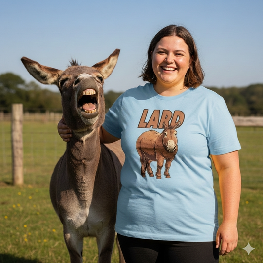 Woman wearing a blue t-shirt with a donkey graphic, standing next to a donkey in an outdoor setting.