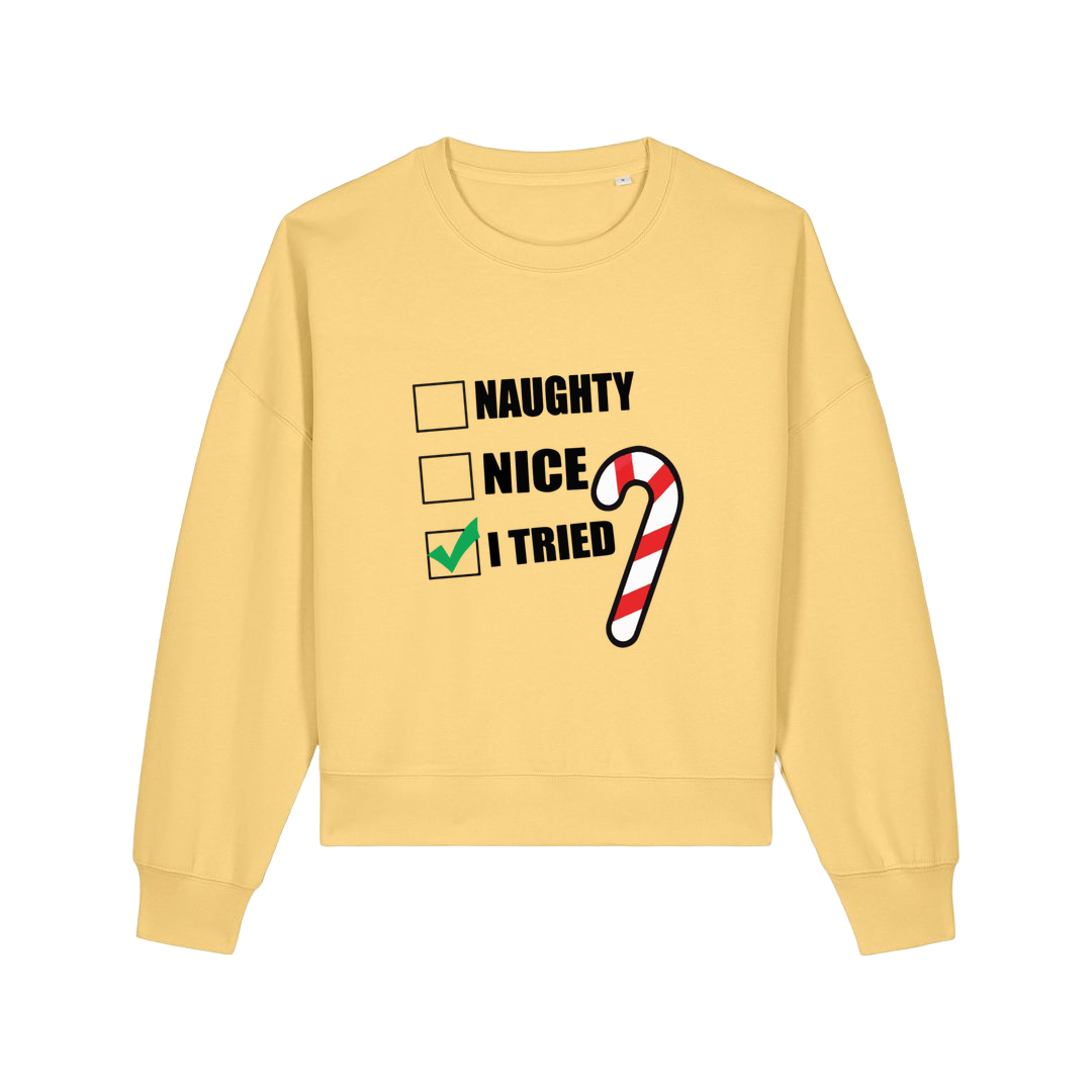yellow christmas sweater with the slogan 'naughty nice i tried'