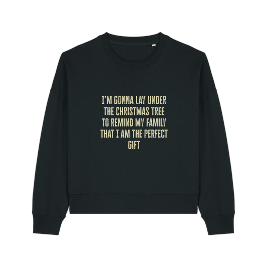 black christmas sweater with the slogan 'i'm gonna lay under the christmas tree to remind my family that i am the perfect gift'