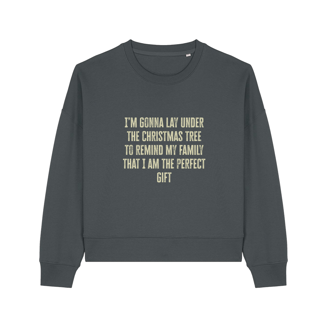 grey christmas sweater with the slogan 'i'm gonna lay under the christmas tree to remind my family that i am the perfect gift'