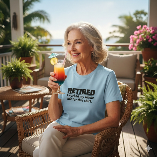 Woman sitting on a patio holding a colorful drink, wearing a light blue t-shirt with text.