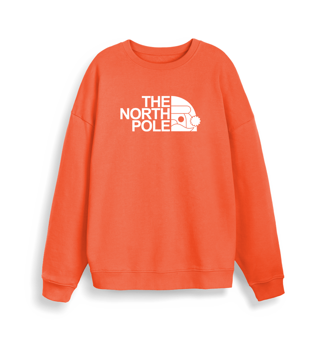 orange christmas sweater with the slogan 'the north pole'
