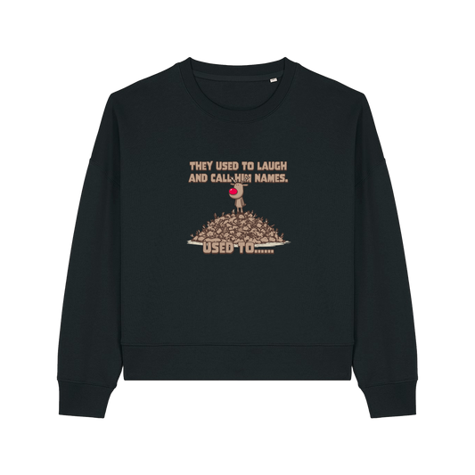 black christmas sweater with the graphic of rudoph stood ontop of a pile of reindeer and the slogan 'they used to laugh and call him names used to ..'