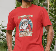 Person wearing a red T-shirt with a Santa graphic and text reading 