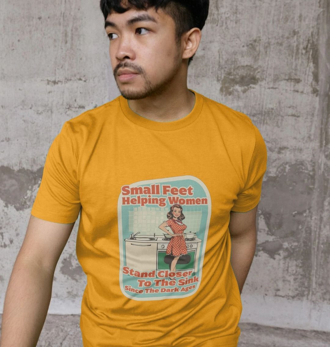 a man wearing a funny offensive t-shirt featuring a retro design with the wording small feet helping women stand closer to the sink since the dark ages
