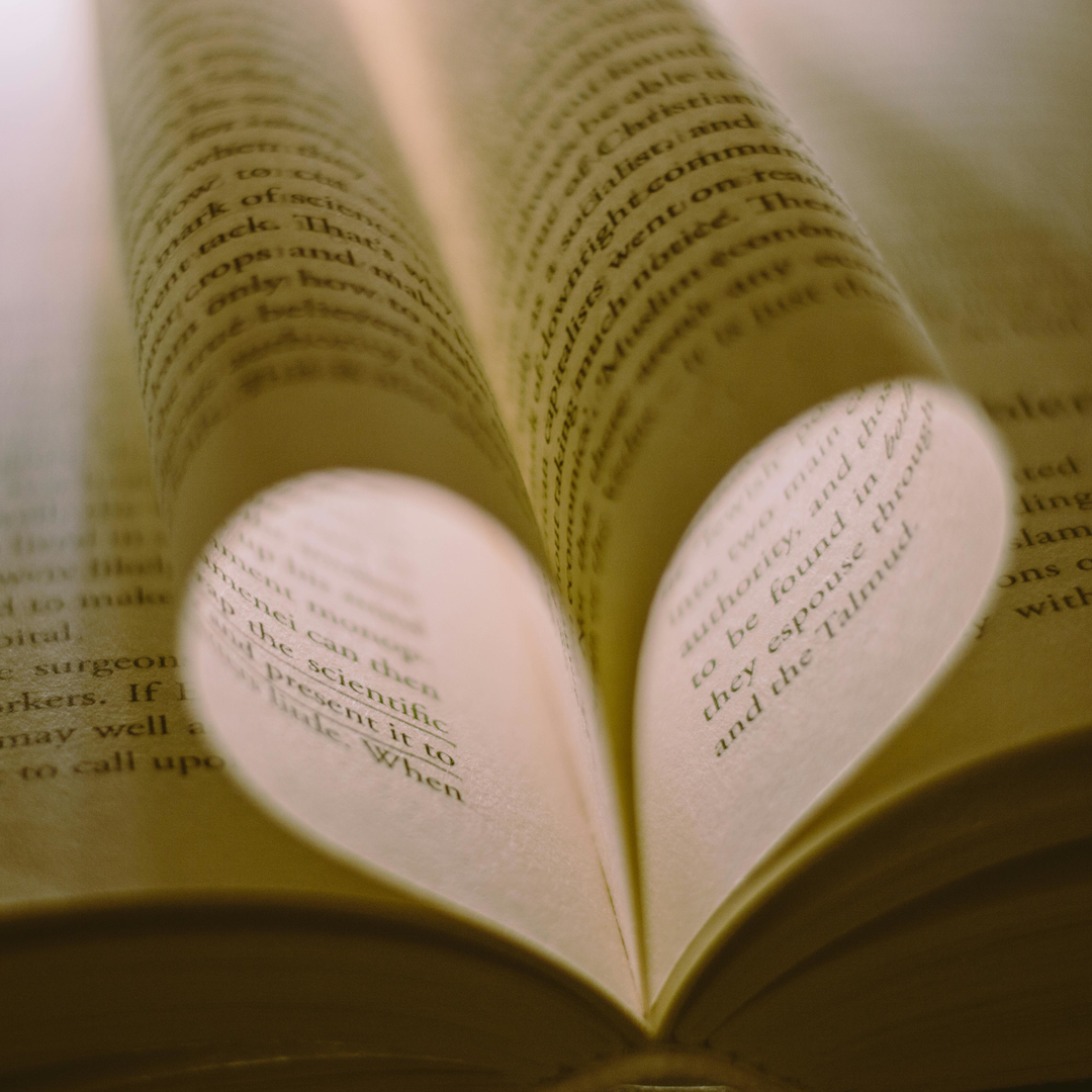 pages of a book curled round to make a heart shape