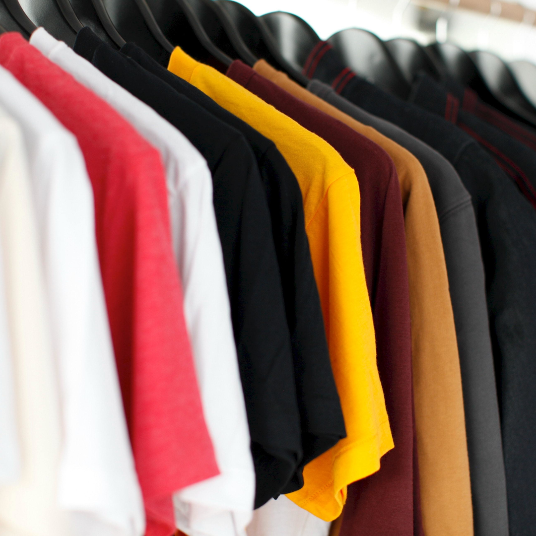 t-shirts hung up in a row 
