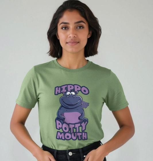 Woman in a green T-shirt with a cartoon hippo and text "Hippo Potty Mouth". She stands against a plain backdrop, conveying a playful mood.
