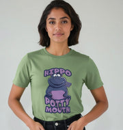 Woman in a green T-shirt with a cartoon hippo and text 