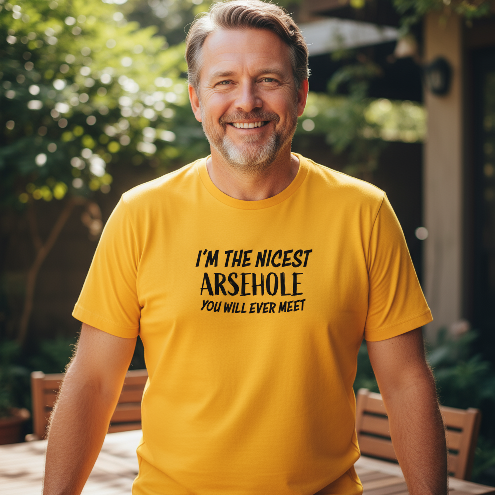 man wearing a yellow slogan t-shirt with the text 'i'm the nicest arsehole you will ever meet'