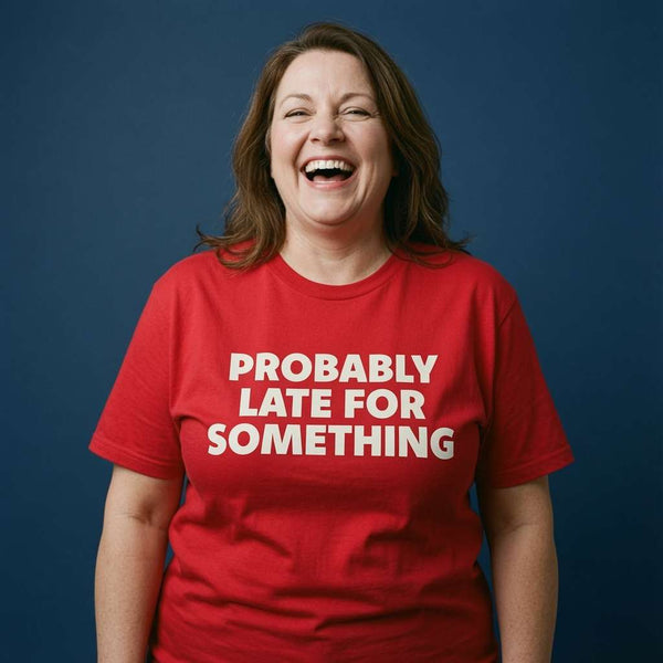 Woman laughing with both arms by her sides in a red Probably Late For Something t-shirt, funny ladies cheeky relatable statement design full of pure attitude