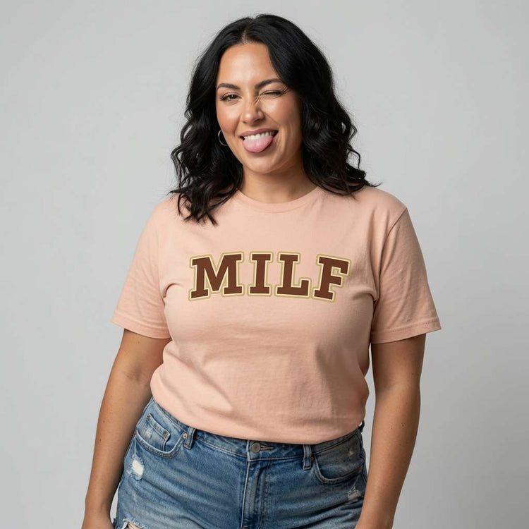 Woman sticking tongue out winking in peach MILF t-shirt, fun ladies milf mum gift slogan