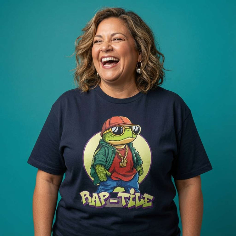 Navy Rap-Tile t-shirt laid flat on a wooden surface showing the full cool turtle graphic, witty ladies turtle pun design that every hip-hop fan will claim