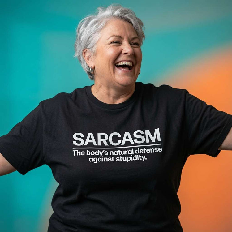 Woman laughing with arms out while wearing a black Sarcasm t-shirt, fun ladies sarcastic slogan design full of pure attitude