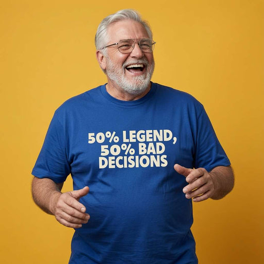 Older man laughing with both hands open while wearing a blue 50% Legend, 50% Bad Decisions t-shirt, fun mens legendary dad gift design full of pure attitude that every cheeky lad will claim