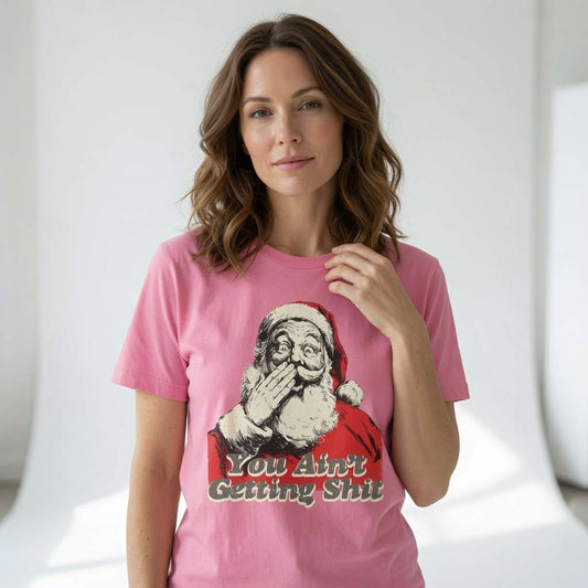 Woman in pink You Ain’t Getting Shit Santa t-shirt, fun rude Christmas gift for the cheeky lady