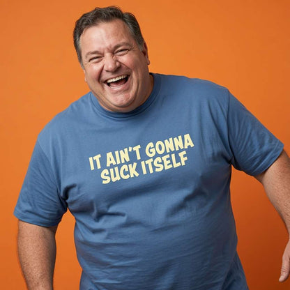 Man laughing hard with one hand on his hip in a blue It Ain’t Gonna Suck Itself t-shirt, mens witty lads cheeky pub banter design