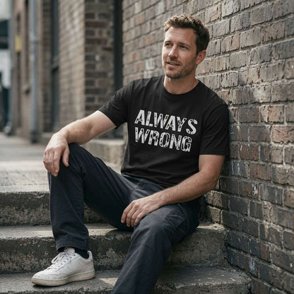 Man in black Always Wrong t-shirt sat on city steps, funny matching couples slogan gift