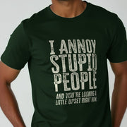 A man wearing a dark green funny slogan T-shirt with bold, distressed white text saying, 