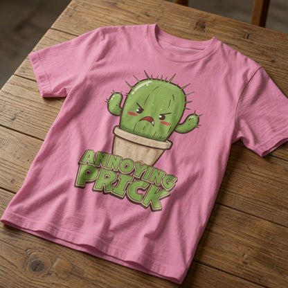 Pink Annoying Prick cactus t-shirt on wooden table, witty funny plants graphic tee for her