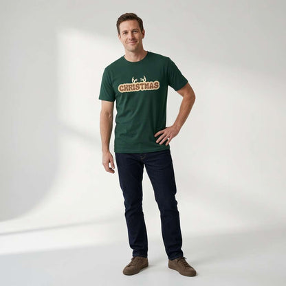 Man in green Christmas antlers t-shirt standing casually, mens christmas fun party shirt