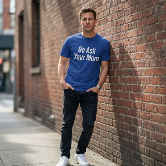 Man in blue Go Ask Your Mum t-shirt leaning on brick wall, perfect fathers day gift tee
