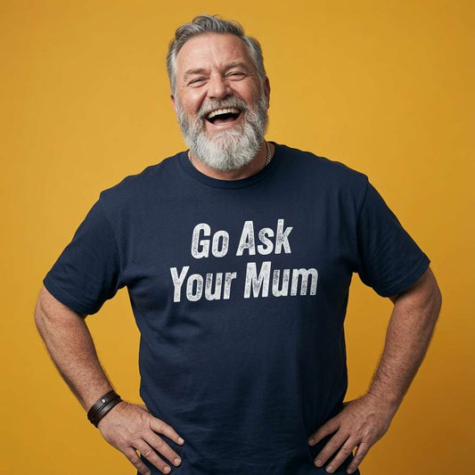 Man laughing with both hands on his hips while wearing a navy Go Ask Your Mum t-shirt, mens the ultimate dad gift design full of pure attitude that every cheeky lad will claim