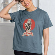 Smiling Woman in a blue Music T-shirt with a retro pin-up design and 