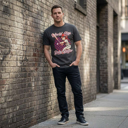 Man in black World Class Baby Batter tee against brick wall, cheeky funny mens baseball pub tee
