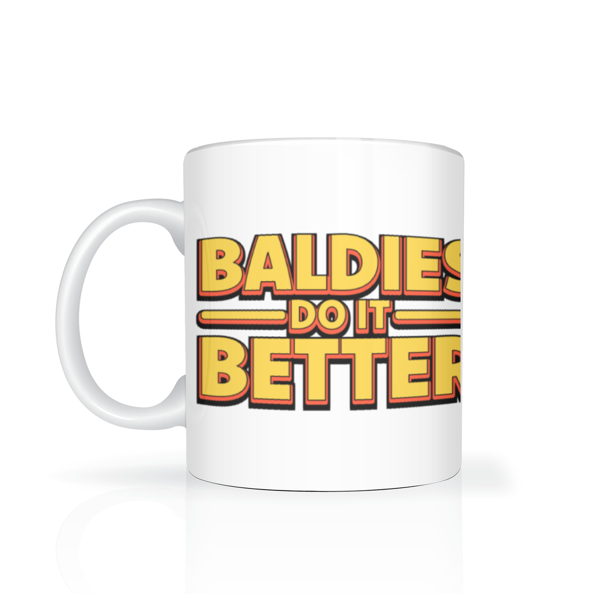 White coffee mug with a left-side handle displays bold retro lettering, “Baldies do it better,” in yellow, red, and black; playful, confident tone.