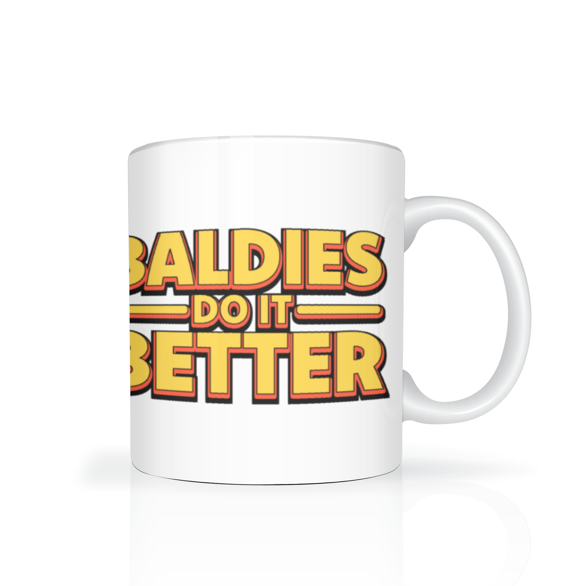 White ceramic mug on a clean studio background, printed with bold retro lettering reading “Baldies Do It Better” in yellow, orange, and black; playful, confident tone.