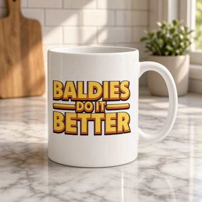 A white mug on a sunlit marble kitchen counter reads “Baldies do it better” in bold retro lettering, creating a playful, confident tone.