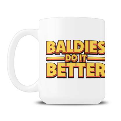 White ceramic mug with a bold red-and-yellow slogan, “Baldies Do It Better,” in retro lettering; playful, lighthearted design on a clean white background.