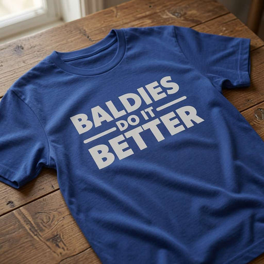 Blue Baldies Do It Better slogan t-shirt on wood, funny humorous bald dad gift tee