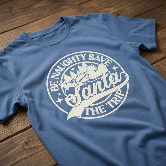 Bright blue Be Naughty Save Santa The Trip t-shirt on wood, funny xmas slogan ladies tee