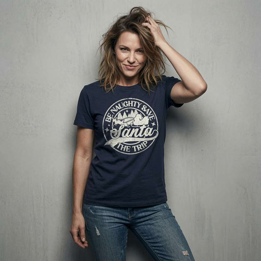 Woman in navy Be Naughty Save Santa The Trip t-shirt, sarcastic cheeky xmas slogan tee