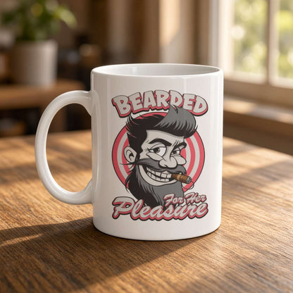 A white ceramic mug on a sunlit wooden table features a cartoon bearded man with a cigar and the words “Bearded for Her Pleasure,” playful vintage style.