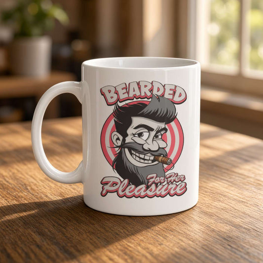 A white ceramic mug on a sunlit wooden table features a cartoon bearded man with a cigar and the words “Bearded for Her Pleasure,” playful vintage style.
