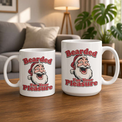 Two white ceramic mugs with a festive Santa graphic and the text 'Bearded For Your Pleasure' are displayed on a wooden table in a cozy living room setting.